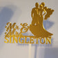 Gold mirror wedding cake topper with silhouette
