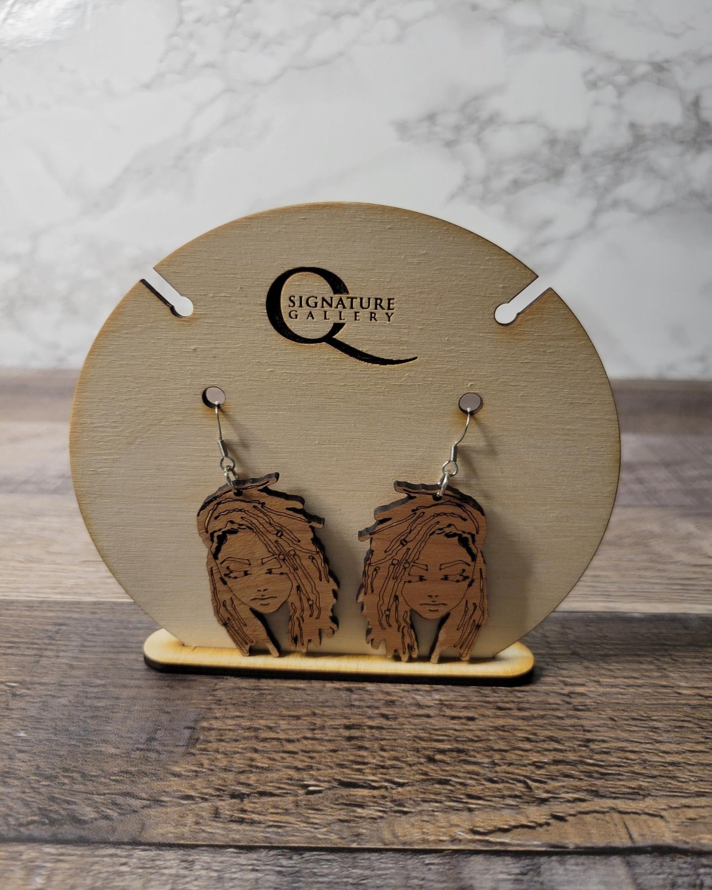 Woman with locs wood earrings