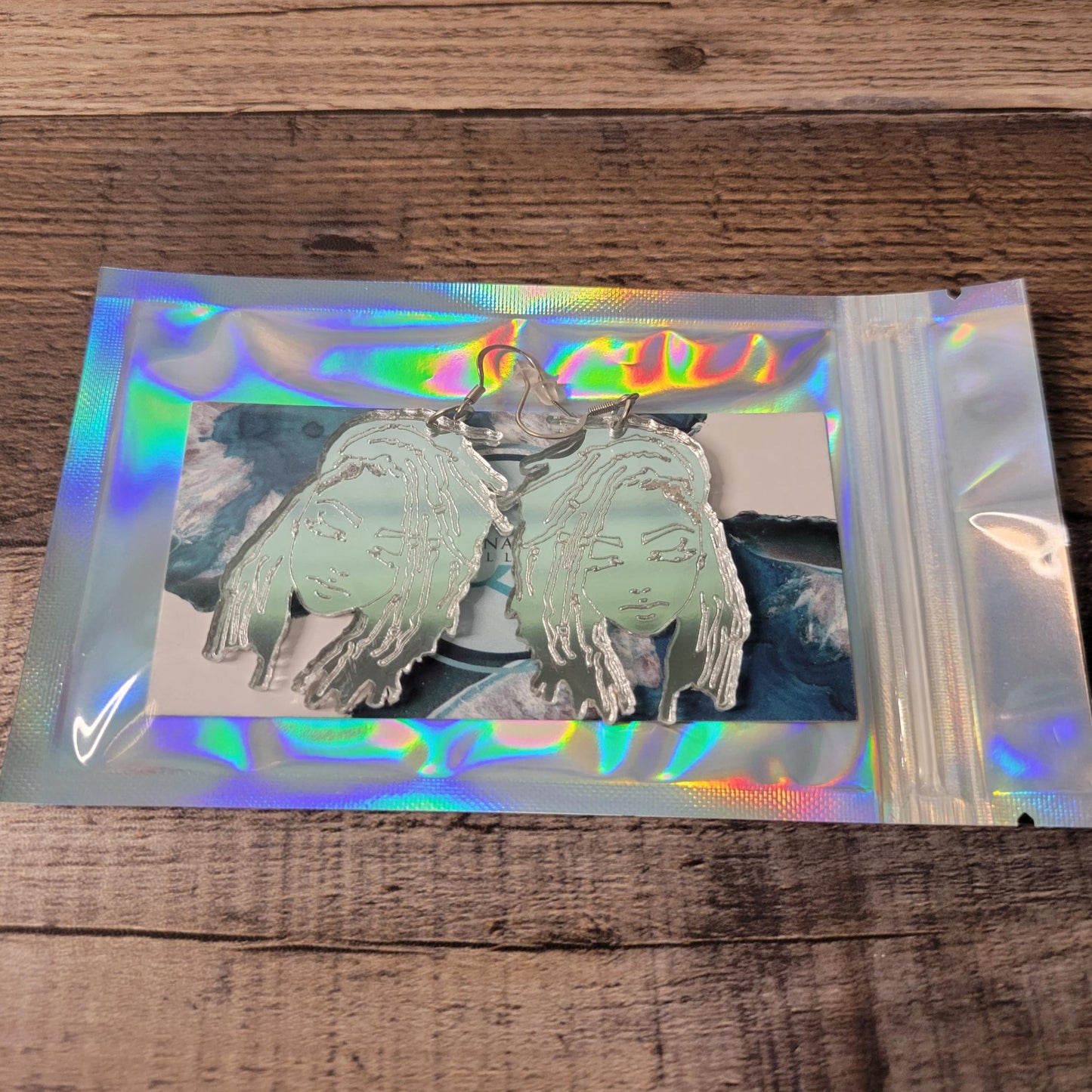 silver acrylic loc lady earrings