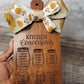 kitchen conversions cutting board/charcuterie board with sunflower ribbon