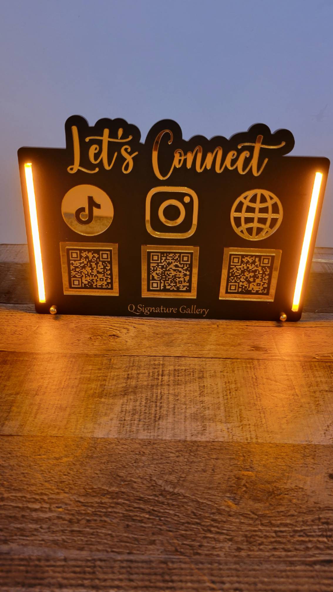Let's Connect LED Sign with black background, gold lights and gold icons