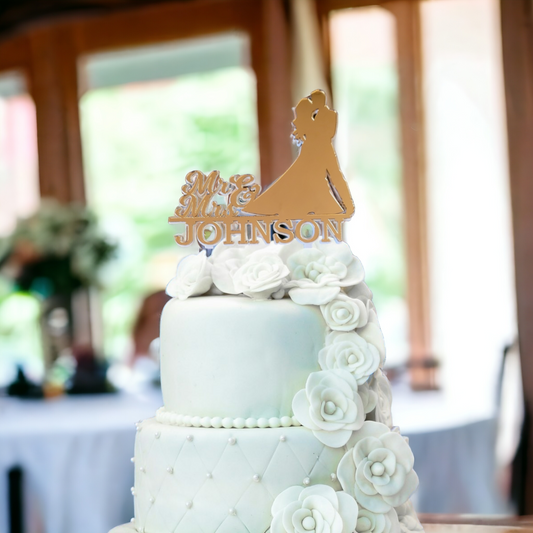 gold mirror cake topper with couple silhouette