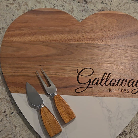 Video: Personalized Heart Marble & Acacia Board — wood and white marble heart board engraved 'Est. 2025' with cheese tools