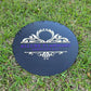 black round acrylic sign with purple letters and gold detail