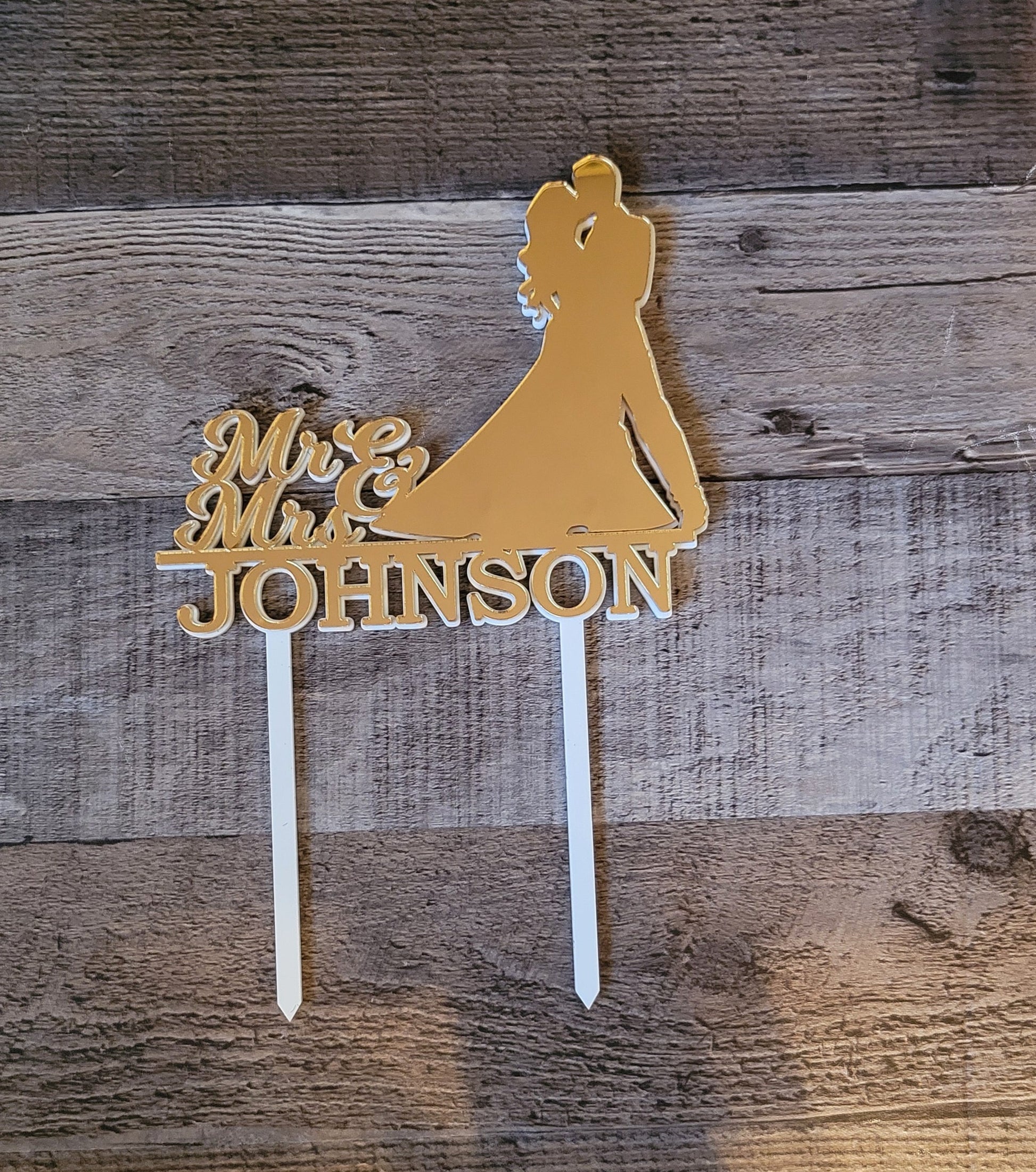 gold mirror cake topper with couple silhouette
