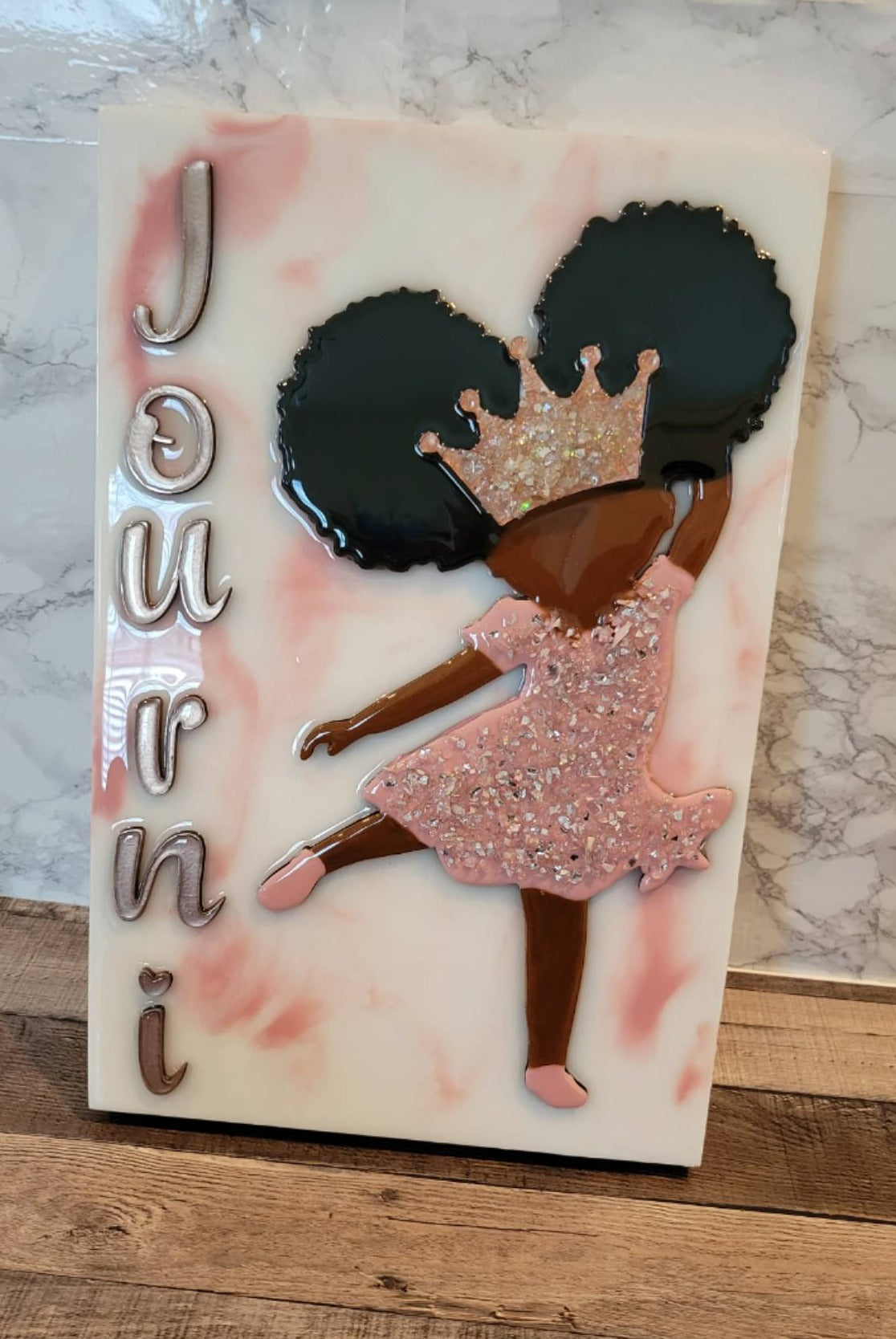 Little ballerina resin painting black girl with afro puffs, pink crushed glass dress. Says the name Journi on the side