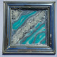 teal and silver painting with mirror frame