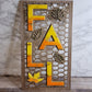 Fall trellis sign with yellow, orange, and gold resin letters