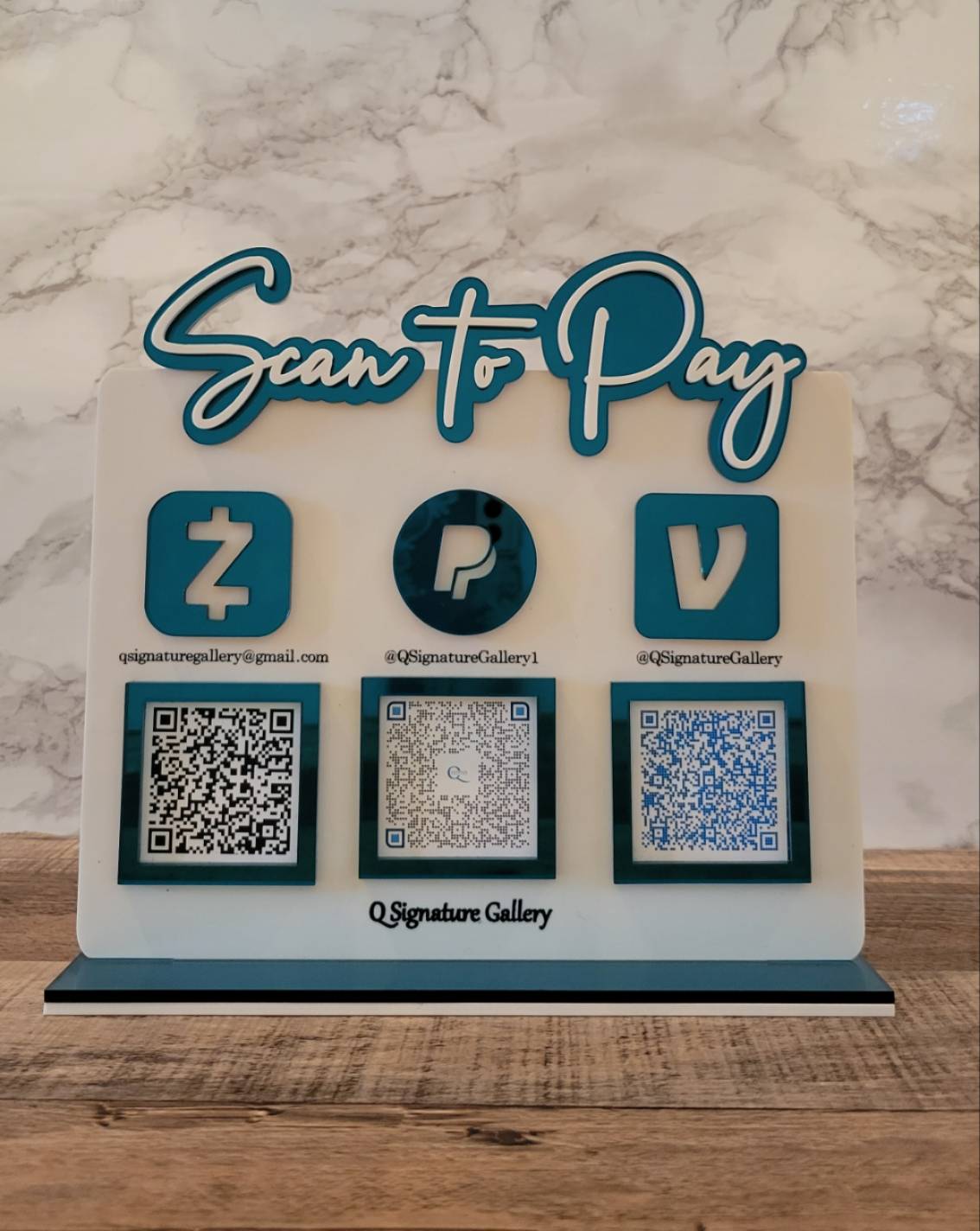 Scan to Pay sign with QR codes in teal mirror