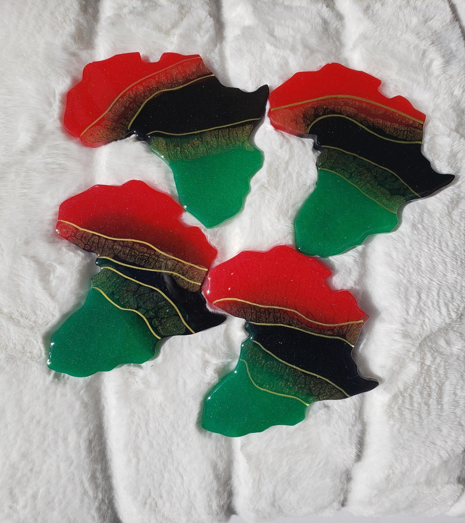 Red, black and green Africa coasters